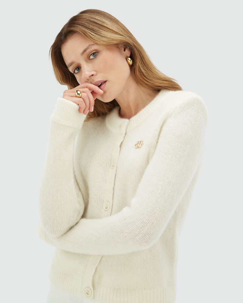 BEBE cardigan with removable ruffle details Ecru BEBE cardigan with removable ruffle details Ecru