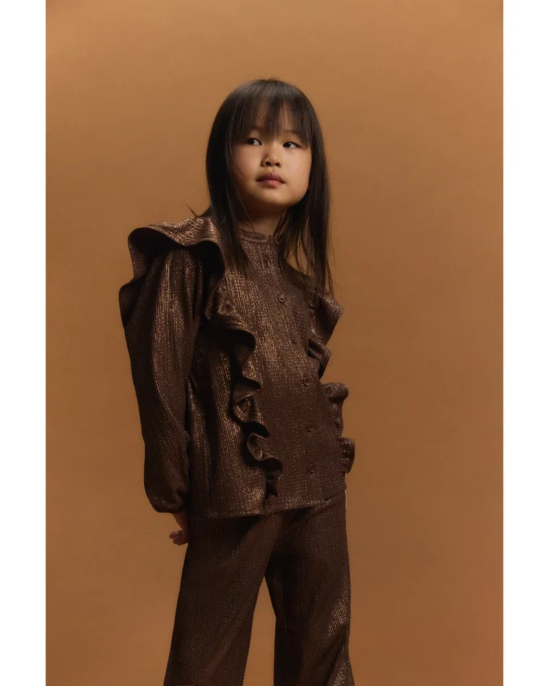 kids knitted shiny ruffle blouse Bruin 1 kids knitted shiny ruffle blouse Bruin 1